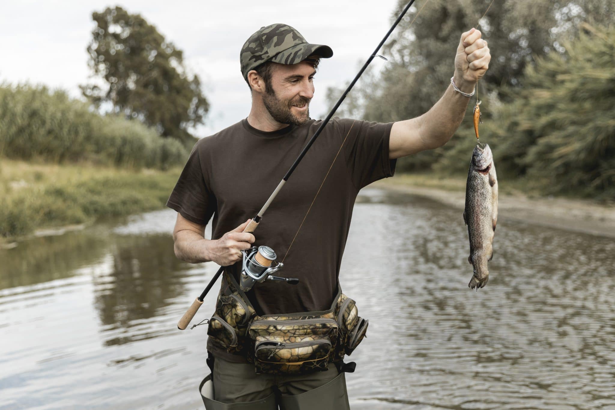 Fisherman. Мужик с удочкой. Мужчина на рыбалке. Человек рыбачит. Человек на рыбалке.